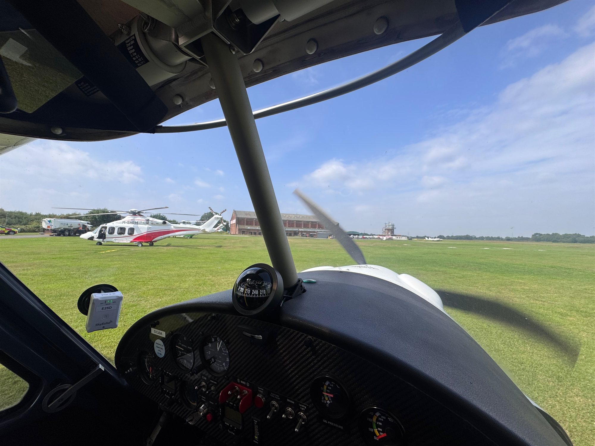 View through a light aircraft canopy at a UK airfield