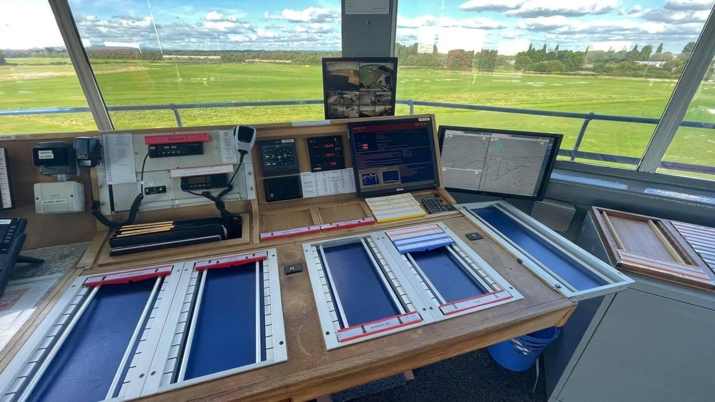 Air traffic tower console with runway view