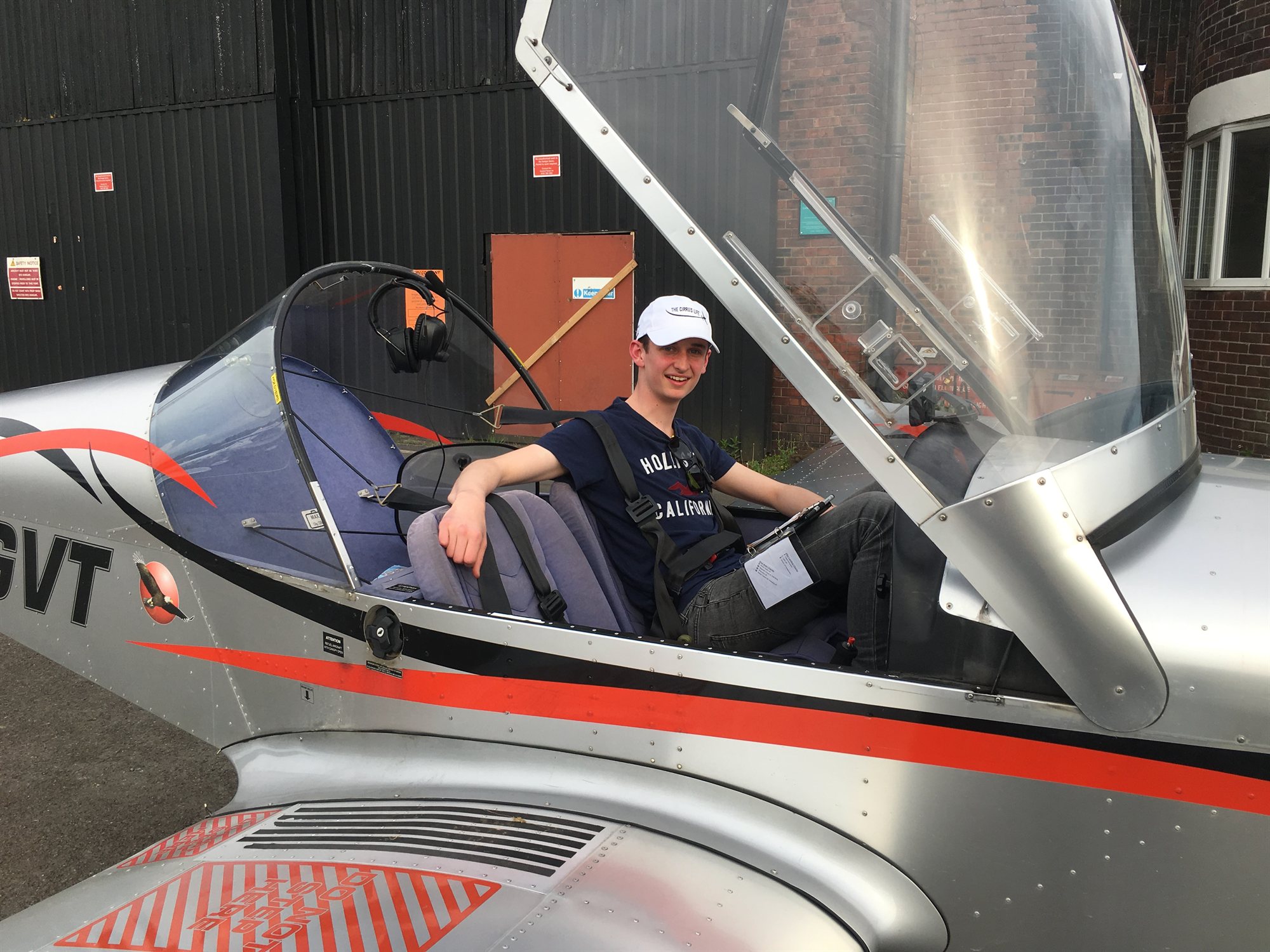 Harry seated in the cockpit of a microlight