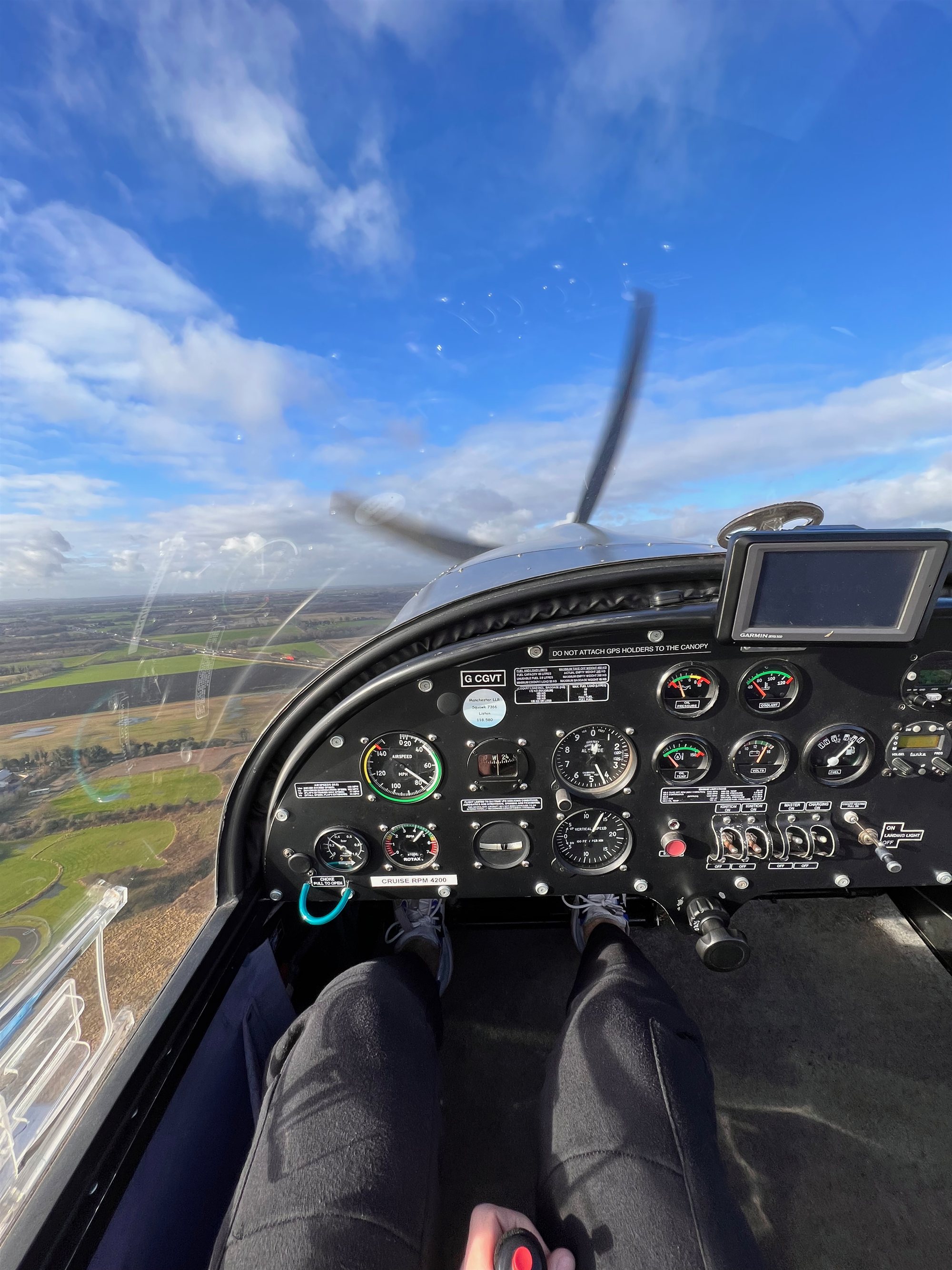 View from a light aircraft cockpit in flight over the UK